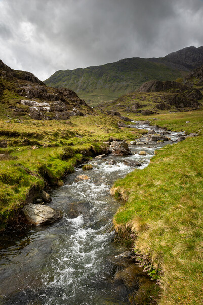 The Afon Cwm Llan by the Watkin Path in the mountains of Snowdonia Picture Board by Andrew Kearton