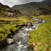 Buy canvas prints of The Afon Cwm Llan by the Watkin Path in the mountains of Snowdonia by Andrew Kearton