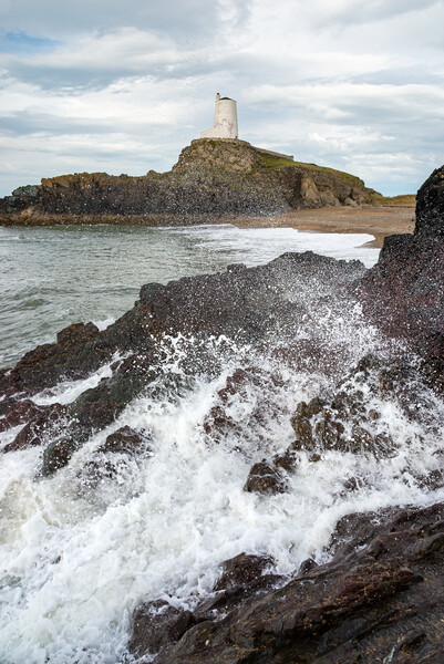 Waves breaking below Twr Mawr lighthouse, Anglesey Picture Board by Andrew Kearton