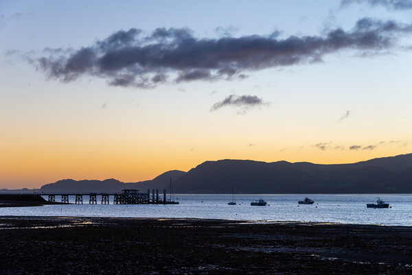 Dawn at Beaumaris, Anglesey, North Wales Picture Board by Andrew Kearton