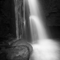 Buy canvas prints of  Lumsdale Falls in black and white by Andrew Kearton