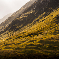 Buy canvas prints of  Autumn sunlight on the mountains of Glencoe, Scot by Andrew Kearton