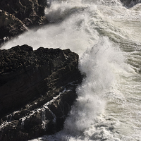 Buy canvas prints of  Powerful waves breaking on the rocks  by Andrew Kearton