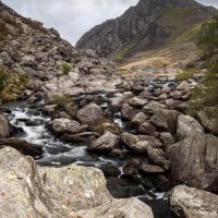 Buy canvas prints of Rugged Snowdonia landscape above Ogwen Falls by Andrew Kearton