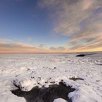 Buy canvas prints of Icy pool on the snowy moors at dusk by Andrew Kearton