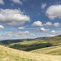 Buy canvas prints of Fluffy clouds over the hills by Andrew Kearton