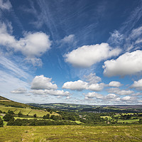Buy canvas prints of Fluffy clouds over Glossop by Andrew Kearton