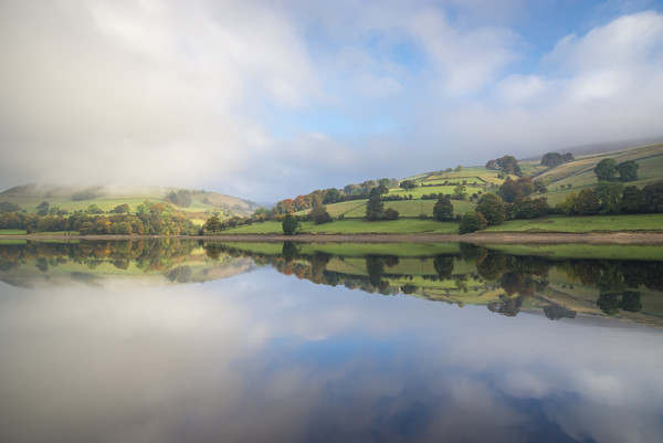 Calm water at Ladybower reservoir, Derbyshire Picture Board by Andrew Kearton