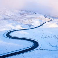 Buy canvas prints of Bendy road through the snow by Andrew Kearton