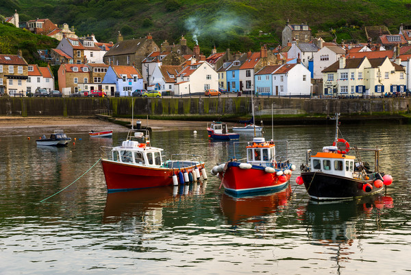 Boats in the harbour, Staithes, North Yorkshire Picture Board by Andrew Kearton