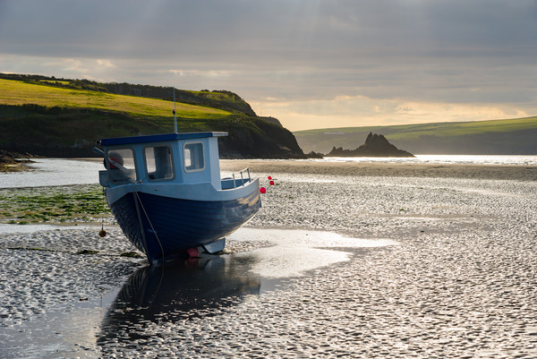 Boat at Newport Sands, Pembrokeshire, Wales Picture Board by Andrew Kearton