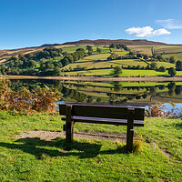 Buy canvas prints of A wooden bench with views of Ladybower reservoir by Andrew Kearton