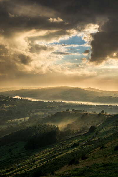 Mist and sunbeams over Charlesworth, Derbyshire Picture Board by Andrew Kearton