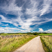 Buy canvas prints of Wispy summer clouds in the White Peak, Derbyshire by Andrew Kearton