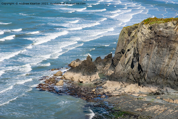 Waves and rocky cliffs at Newport, Pembrokeshire Picture Board by Andrew Kearton