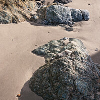 Buy canvas prints of Soft sand and textured rocks by Andrew Kearton