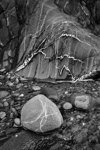Veins in rock at Trefin beach, Pembrokeshire Picture Board by Andrew Kearton