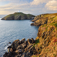Buy canvas prints of Strumble Head lighthouse at sunset, Pembrokeshire by Andrew Kearton