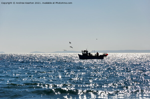 Little fishing boat off the coast of Wales Picture Board by Andrew Kearton