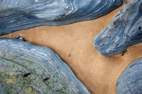 Sand and rock abstract, Penbryn beach, Wales Picture Board by Andrew Kearton
