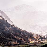 Buy canvas prints of Snow Squalls over Seathwaite by John Malley