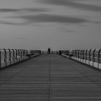 Buy canvas prints of  'the lovers' at the end of the pier by David Oxtaby  ARPS