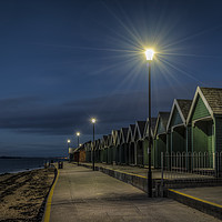 Buy canvas prints of Beach Huts at Gurnard bay at dusk by David Oxtaby  ARPS