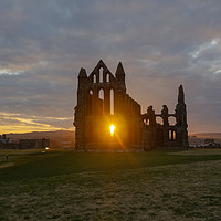 Buy canvas prints of Sun setting at Whitby Abbey by David Oxtaby  ARPS