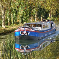 Buy canvas prints of  Peniche Mirabelle on the Canal de Garonne, France by Mike Ricketts