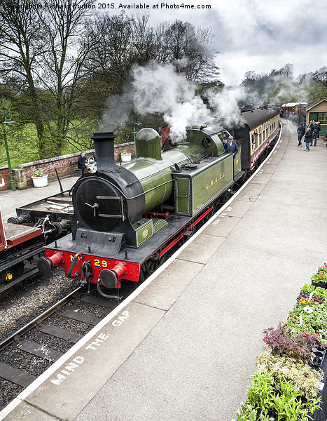  A steam train arriving in Pickering station Picture Board by Richard Burdon