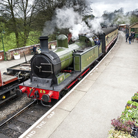 Buy canvas prints of  A steam train arriving in Pickering station by Richard Burdon