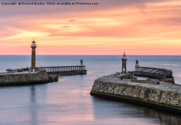 Whitby pier at sunset Picture Board by Richard Burdon