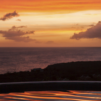 Buy canvas prints of Sunset over a pool overlooking the sea - Curacao C by Gail Johnson
