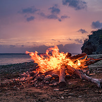 Buy canvas prints of A fantastic sunset at the beach with a bonfire and by Gail Johnson