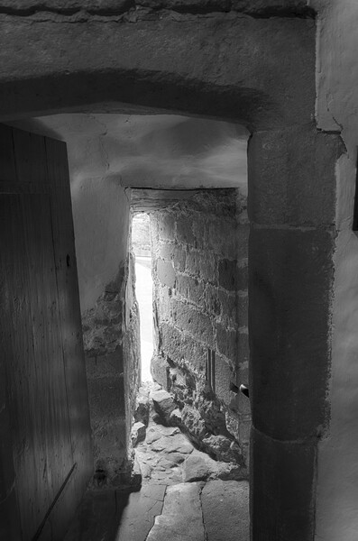 Skipton Castle - Medieval Passageway Mono Picture Board by Glen Allen