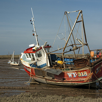 Buy canvas prints of Whitby Crest at Brancaster Staithe by John Edwards