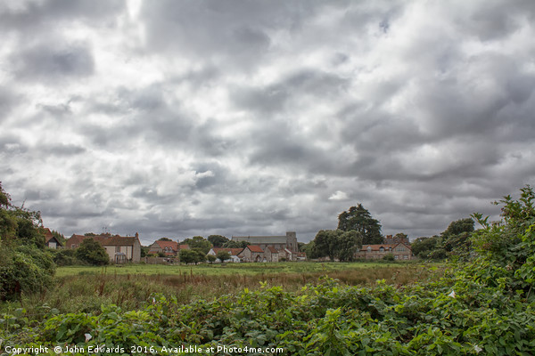 Thornham Norfolk under a leaden sky Picture Board by John Edwards