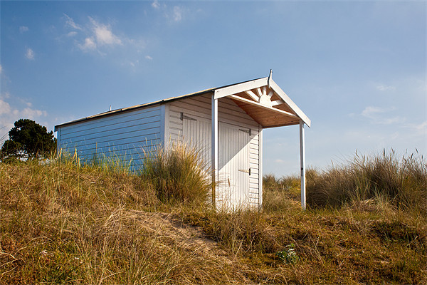 A Beach hut in the Marram Grass at Old Hunstanton, Picture Board by John Edwards