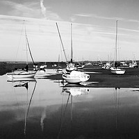 Buy canvas prints of Reflections at Brancaster Staithe by John Edwards