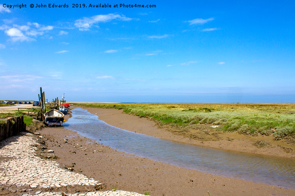 Low tide at Thornham Staithe  Picture Board by John Edwards