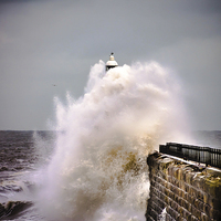Buy canvas prints of Tynemouth pier during a storm by David Irving