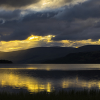 Buy canvas prints of  Early morning storm clouds over Loch Tay by David Irving