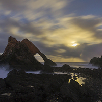 Buy canvas prints of  Bow Fiddle Rock by moonlight by Andy Martin