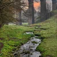 Buy canvas prints of A viaduct over a body of water after heavy rain. by David Smith