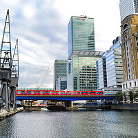 Buy canvas prints of Train Into Canary Wharf by David Smith