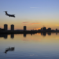Buy canvas prints of  Arriving Plane at Sunset by Ayo Faleye