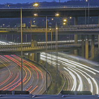 Buy canvas prints of  Motorway Junction of M23 and M25 at dusk by Michael Chandler