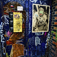 Buy canvas prints of  Graffiti covered door by Peter Jones