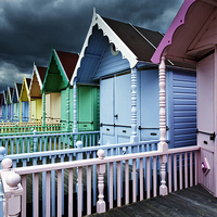 Buy canvas prints of  Beach Huts & Storm Clouds by Peter Jones