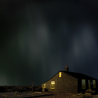 Buy canvas prints of Sky over famous cottage Dungeness, Kent, UK by Peter Jones